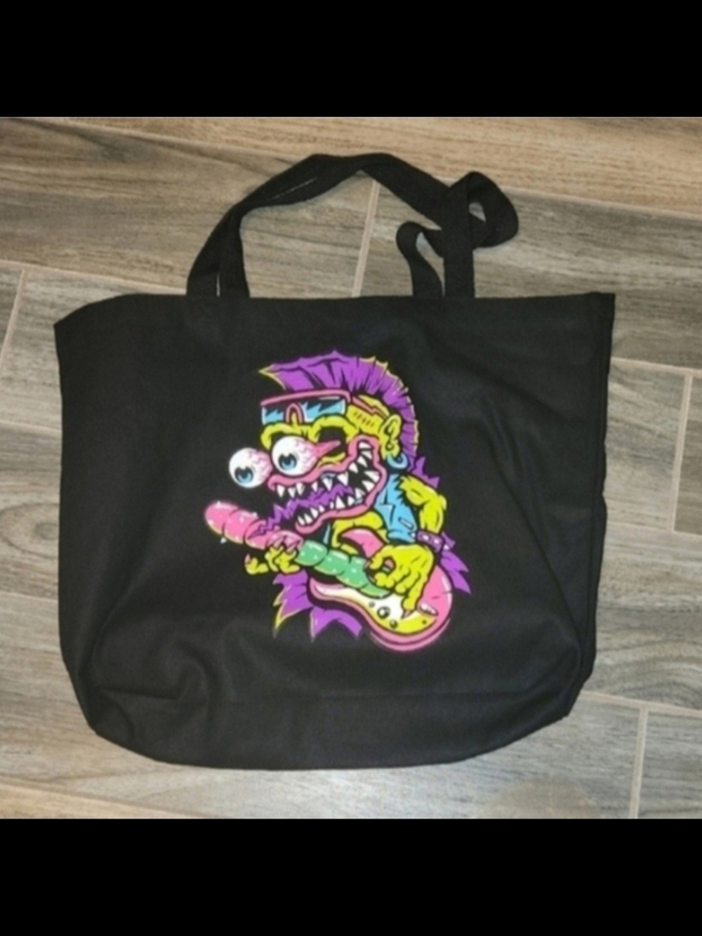 Black Tote Bag with Neon Cartoon Guitar Monster Graphic